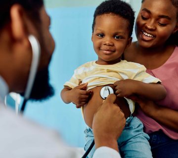 Smiling black boy during medical checkup at pediat 2026 01 06 10 28 02 utc 1001 360x320