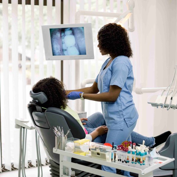 Dental care pretty african female doctor making e 2026 03 26 08 28 01 utc001 600x600