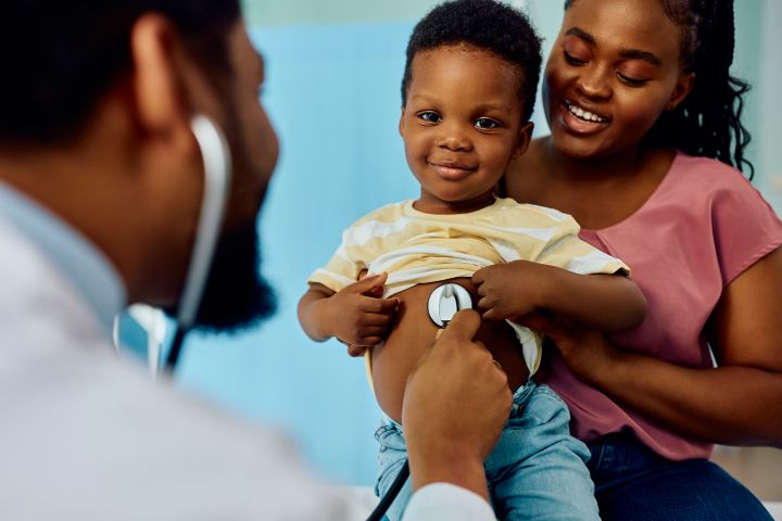 Smiling black boy during medical checkup at pediat 2026 01 06 10 28 02 utc001